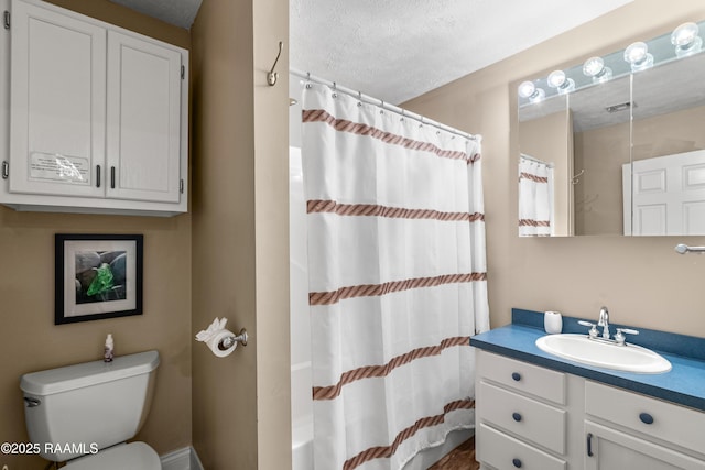 4998 Airhart Rd Unit A, Lake Charles, LA 70605 - full bath with a textured ceiling, visible vents, curtained shower, vanity, and toilet
