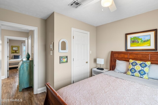 4998 Airhart Rd Unit A, Lake Charles, LA 70605 - bedroom featuring visible vents, a ceiling fan, baseboards, and wood finished floors