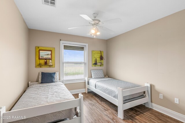 4998 Airhart Rd Unit A, Lake Charles, LA 70605 - bedroom featuring visible vents, a ceiling fan, baseboards, and wood finished floors