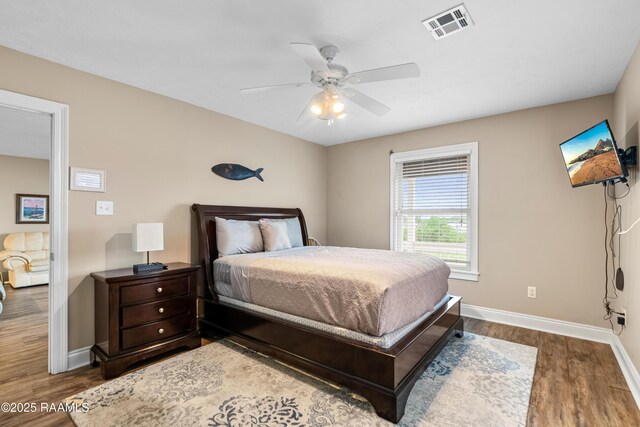 4998 Airhart Rd Unit A, Lake Charles, LA 70605 - bedroom featuring visible vents, a ceiling fan, baseboards, and wood finished floors