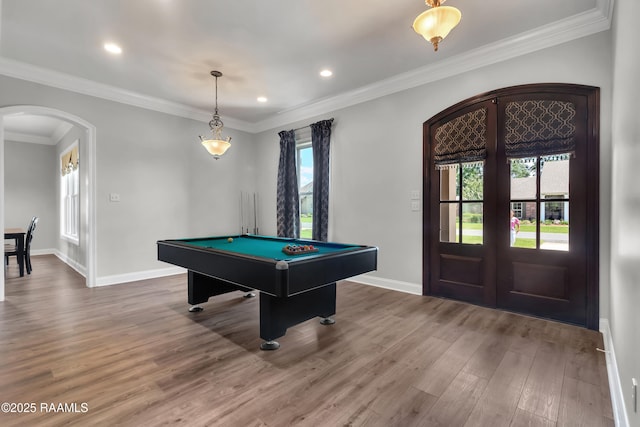 recreation room featuring wood finished floors, baseboards, billiards, french doors, and arched walkways