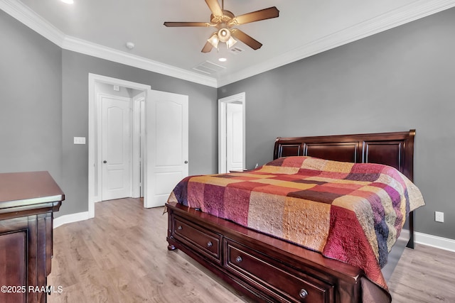bedroom with baseboards, visible vents, ornamental molding, and light wood-style flooring