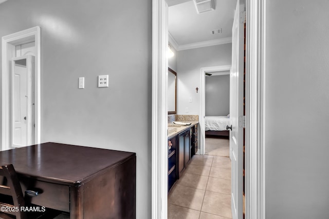 bathroom with crown molding, visible vents, tile patterned flooring, and ensuite bath