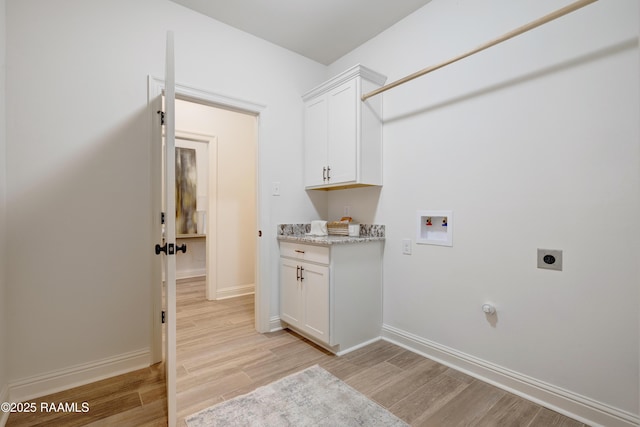 laundry room featuring light wood-type flooring, hookup for a washing machine, baseboards, and hookup for an electric dryer