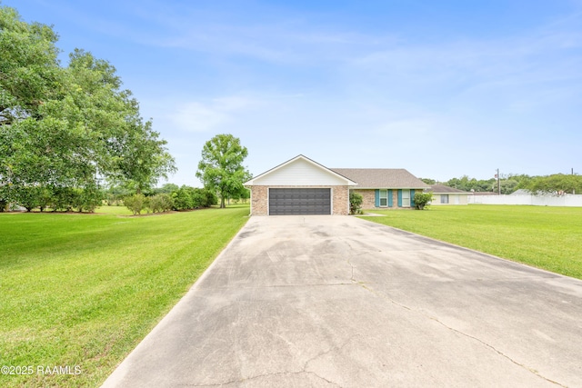 ranch-style home featuring driveway, an attached garage, brick siding, and a front yard