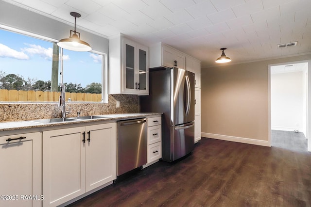 109 W Roosevelt St, Broussard, LA 70518 - kitchen featuring appliances with stainless steel finishes, a sink, glass insert cabinets, white cabinetry, and crown molding