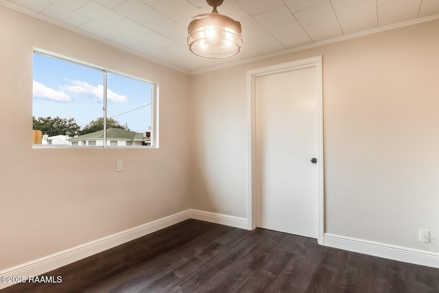 109 W Roosevelt St, Broussard, LA 70518 - spare room featuring crown molding, dark wood finished floors, and baseboards