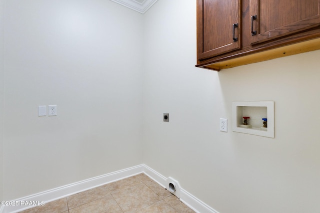 washroom featuring baseboards, hookup for an electric dryer, cabinet space, light tile patterned floors, and washer hookup