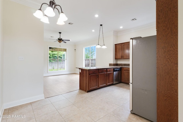kitchen with decorative light fixtures, crown molding, appliances with stainless steel finishes, visible vents, and a peninsula