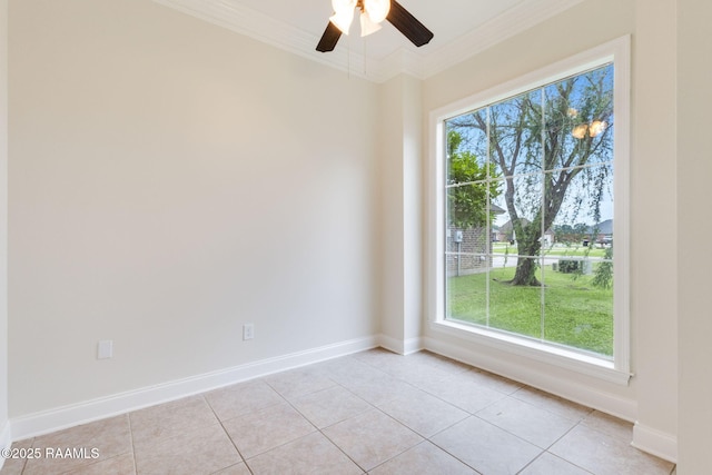 spare room with crown molding, baseboards, ceiling fan, and light tile patterned flooring