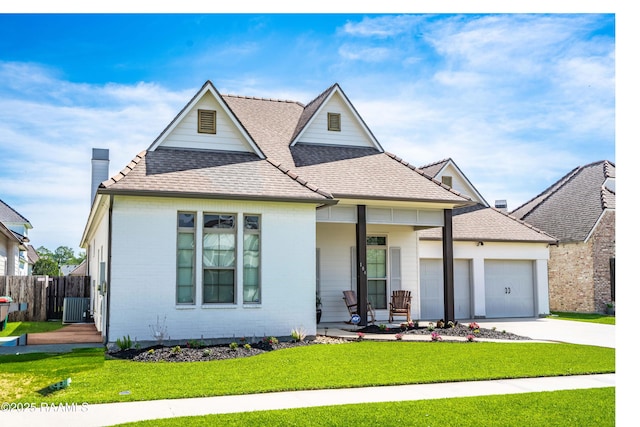 104 Peaceful Hollow Ln, Lafayette, LA 70508 - view of front of property featuring roof with shingles, an attached garage, a porch, and a front lawn