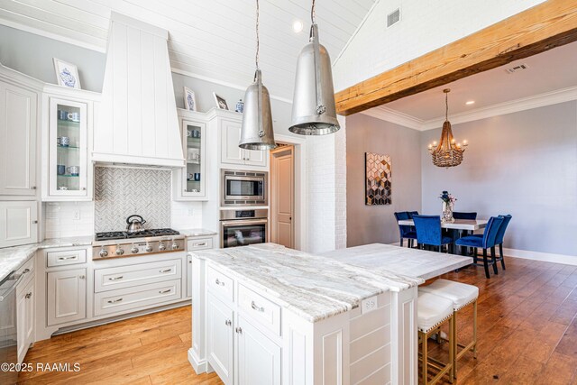 104 Peaceful Hollow Ln, Lafayette, LA 70508 - kitchen featuring backsplash, appliances with stainless steel finishes, custom exhaust hood, and light wood-type flooring