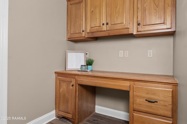 1115 Jules Broussard Rd, Breaux Bridge, LA 70517 - home office with built in study area, baseboards, and dark wood finished floors