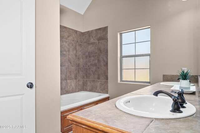 1115 Jules Broussard Rd, Breaux Bridge, LA 70517 - full bathroom featuring double vanity, a sink, a bathtub, and a skylight