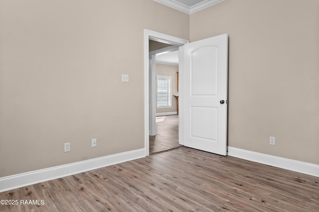 1115 Jules Broussard Rd, Breaux Bridge, LA 70517 - empty room with crown molding, baseboards, and wood finished floors