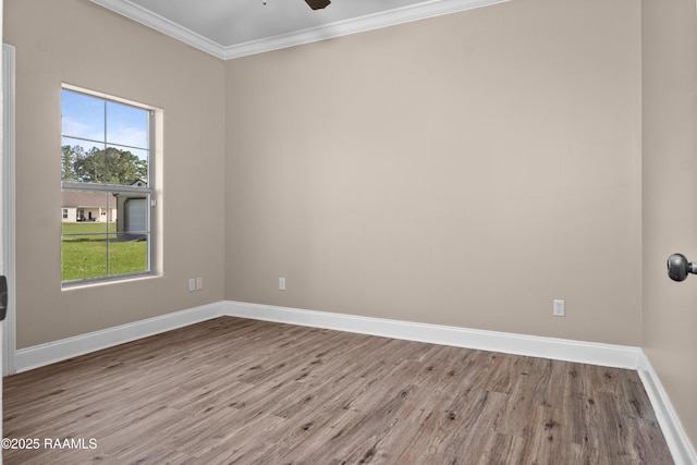 1115 Jules Broussard Rd, Breaux Bridge, LA 70517 - spare room with crown molding, a ceiling fan, baseboards, and wood finished floors