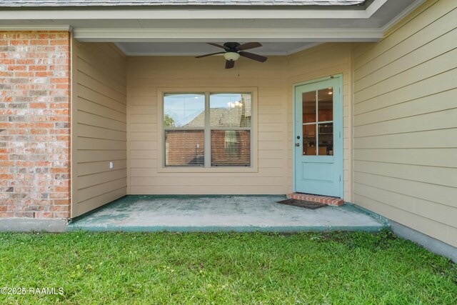 1115 Jules Broussard Rd, Breaux Bridge, LA 70517 - view of exterior entry with brick siding and a ceiling fan