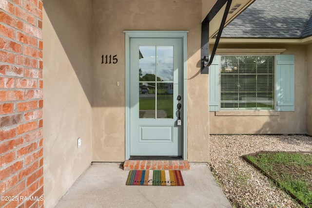 1115 Jules Broussard Rd, Breaux Bridge, LA 70517 - entrance to property with a shingled roof and stucco siding