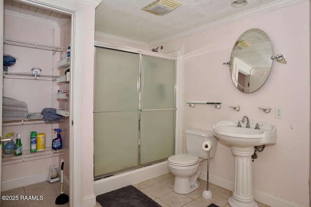 118 Fraternity Dr, Lafayette, LA 70506 - full bathroom featuring visible vents, crown molding, tile patterned flooring, a stall shower, and toilet