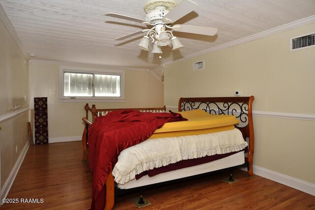118 Fraternity Dr, Lafayette, LA 70506 - bedroom featuring visible vents, crown molding, and wood finished floors