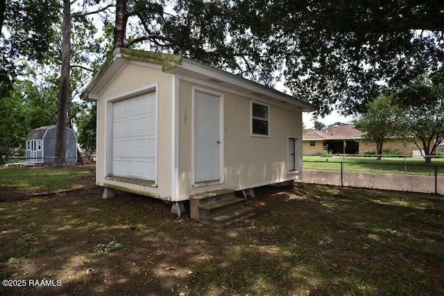 118 Fraternity Dr, Lafayette, LA 70506 - view of outbuilding featuring entry steps, fence, and an outdoor structure