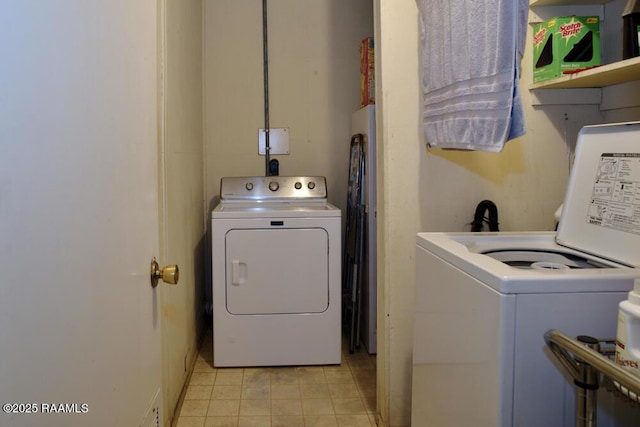 118 Fraternity Dr, Lafayette, LA 70506 - clothes washing area featuring washer and dryer, light tile patterned flooring, and laundry area