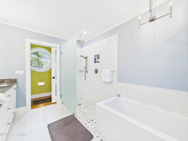 bathroom with a garden tub, walk in shower, vanity, baseboards, and ornamental molding