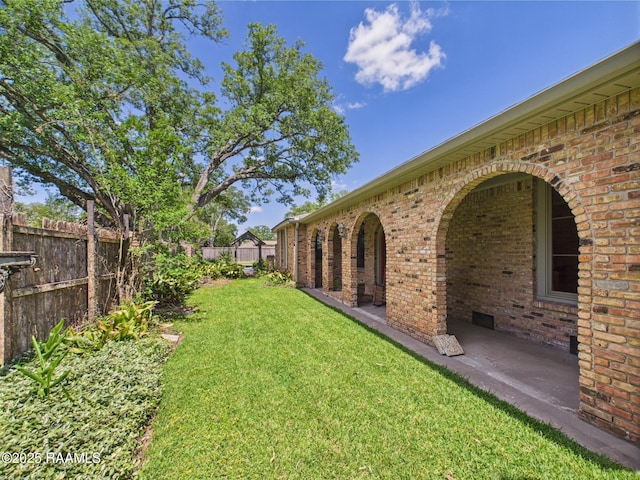 view of yard with a patio and fence