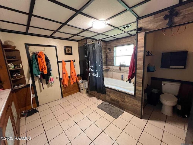 bathroom with tile patterned floors, toilet, and visible vents