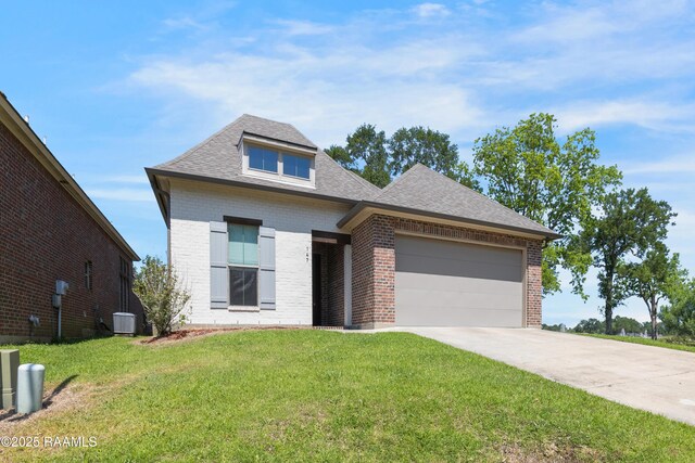 147 Heathwood Dr, Broussard, LA 70518 - view of front facade featuring brick siding, central AC, a garage, and a front lawn