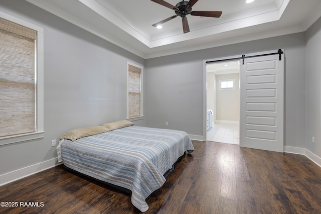 147 Heathwood Dr, Broussard, LA 70518 - bedroom with a barn door, a raised ceiling, wood finished floors, ornamental molding, and recessed lighting