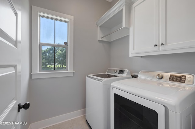147 Heathwood Dr, Broussard, LA 70518 - washroom featuring independent washer and dryer, baseboards, cabinet space, and light tile patterned floors