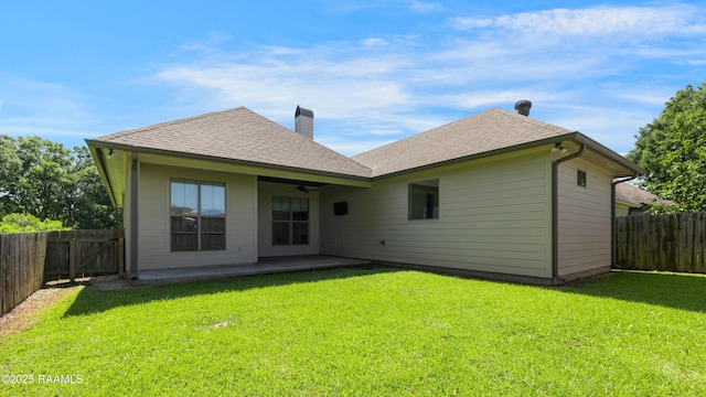 147 Heathwood Dr, Broussard, LA 70518 - back of house with a ceiling fan, a chimney, roof with shingles, and a patio area