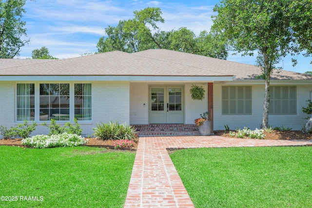 1022 Roselawn Dr, Lafayette, LA 70503 - single story home featuring brick siding, a front lawn, and roof with shingles