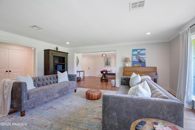 1022 Roselawn Dr, Lafayette, LA 70503 - living area featuring ornamental molding, recessed lighting, wood finished floors, and visible vents