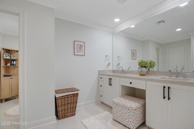 1022 Roselawn Dr, Lafayette, LA 70503 - bathroom featuring visible vents, a sink, baseboards, and ornamental molding