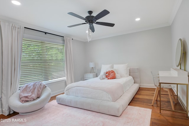 1022 Roselawn Dr, Lafayette, LA 70503 - bedroom with crown molding, ceiling fan, recessed lighting, baseboards, and wood finished floors