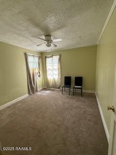 living area with carpet flooring, a ceiling fan, a textured ceiling, and baseboards