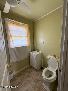 bathroom with ornamental molding and toilet
