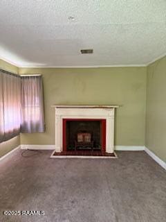 unfurnished living room featuring a textured ceiling, baseboards, and carpet