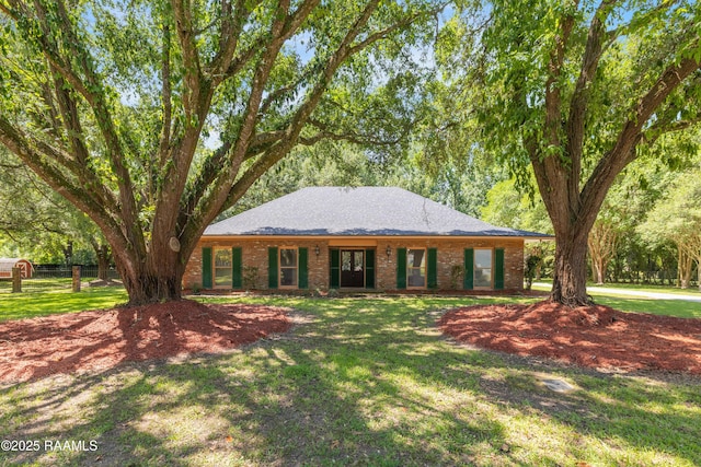 201 W Eleanor St, Opelousas, LA 70570 - ranch-style house with a front lawn, brick siding, and a shingled roof