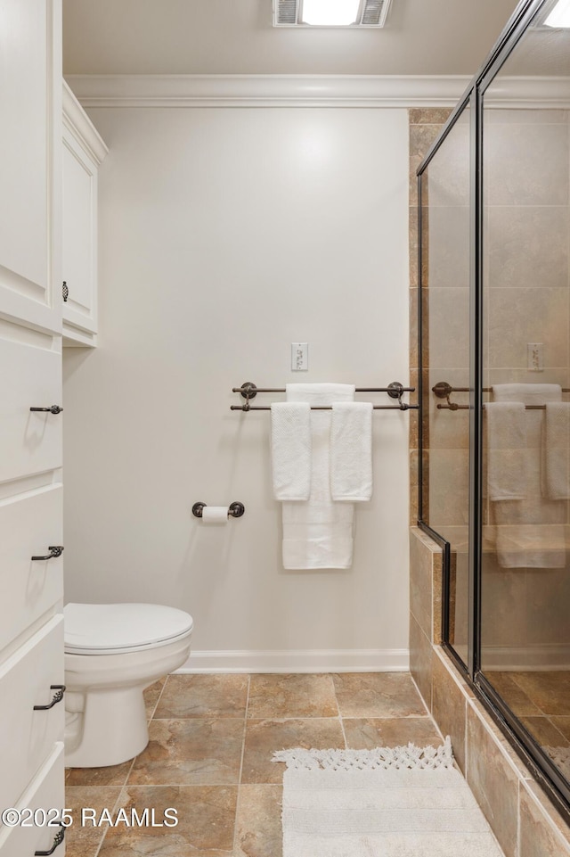 201 W Eleanor St, Opelousas, LA 70570 - bathroom with a tile shower, stone tile floors, and crown molding