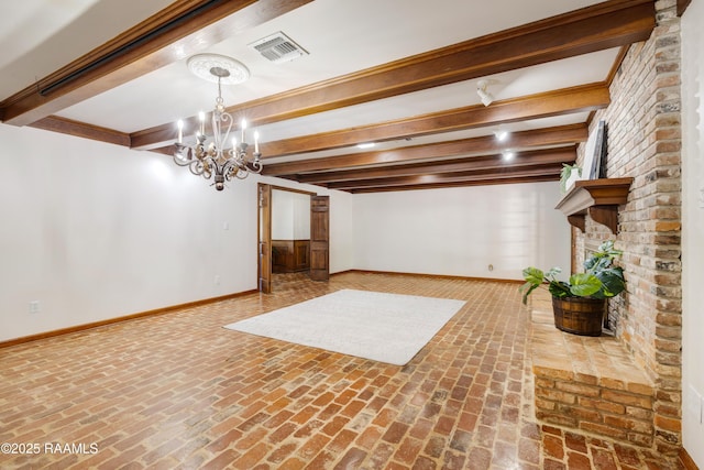 201 W Eleanor St, Opelousas, LA 70570 - basement with brick flooring, a chandelier, and a fireplace