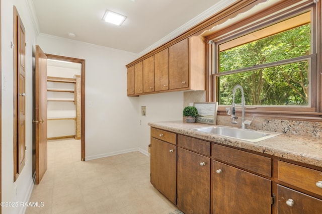 201 W Eleanor St, Opelousas, LA 70570 - kitchen featuring ornamental molding, backsplash, and brown cabinetry