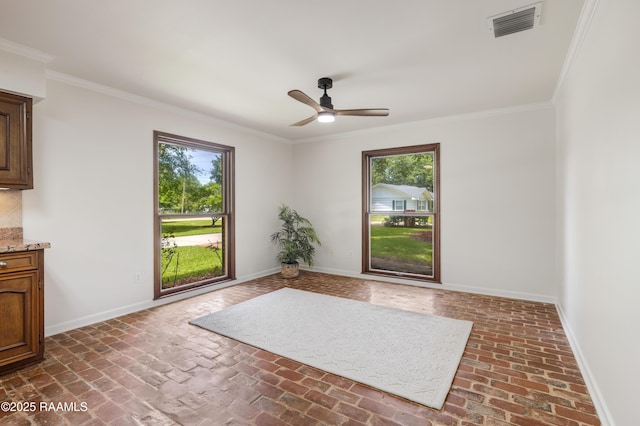 201 W Eleanor St, Opelousas, LA 70570 - unfurnished room featuring brick flooring, crown molding, and ceiling fan