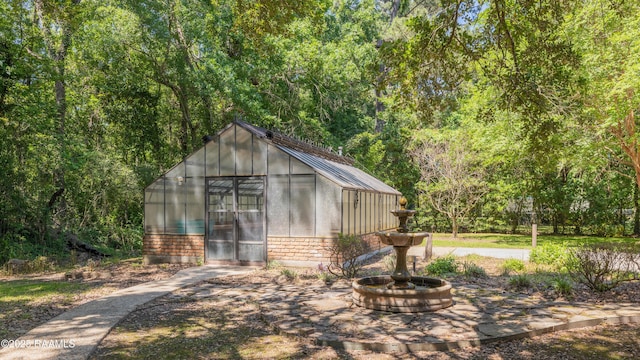 201 W Eleanor St, Opelousas, LA 70570 - view of greenhouse featuring a forest view