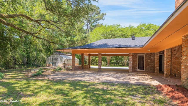 201 W Eleanor St, Opelousas, LA 70570 - view of grassy yard with an outbuilding