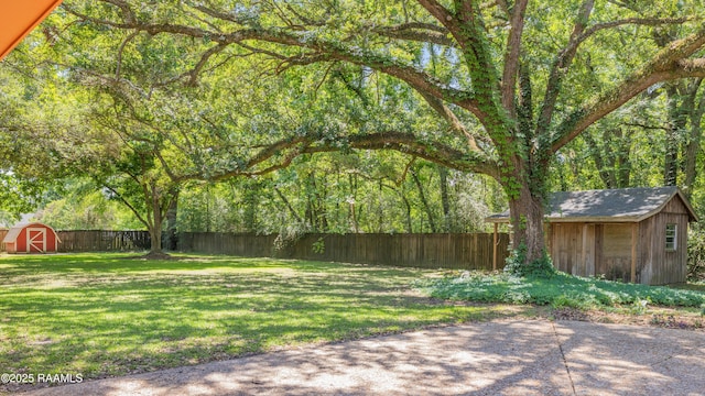 201 W Eleanor St, Opelousas, LA 70570 - fenced backyard featuring a storage shed and a patio area