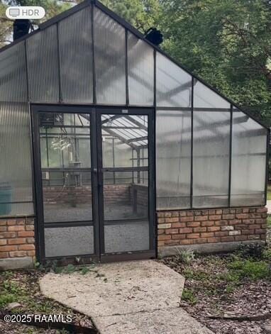 201 W Eleanor St, Opelousas, LA 70570 - view of side of home featuring an exterior structure, an outdoor structure, and brick siding