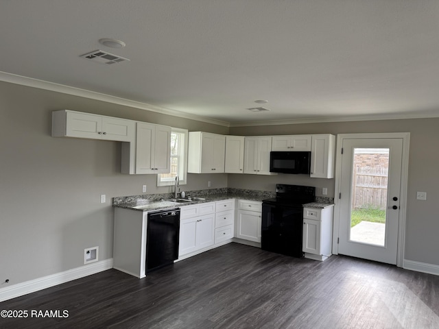 kitchen with crown molding, white cabinetry, baseboards, and black appliances